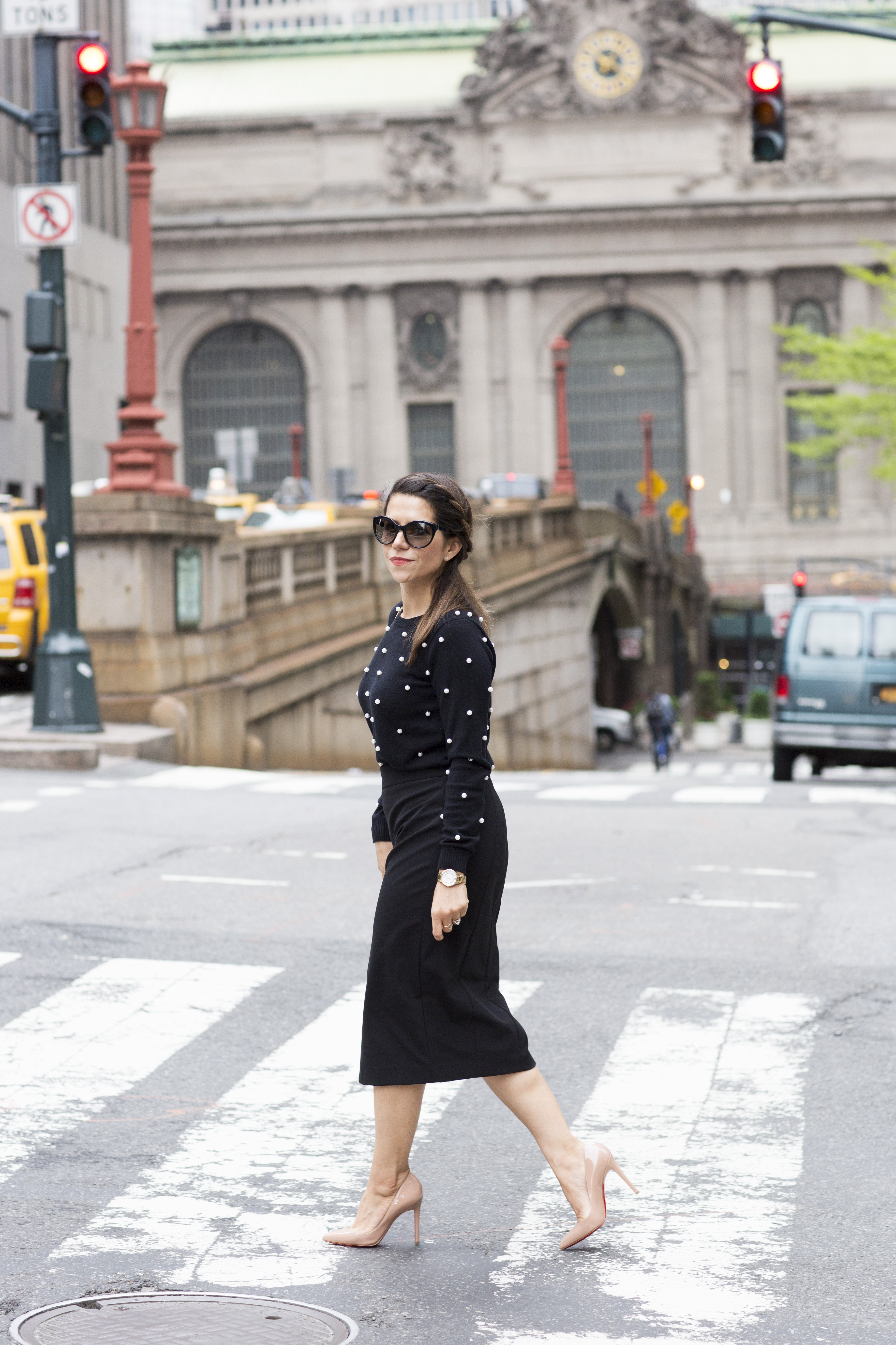 polka dot sweater with black midi skirt wearing in the spring by corporate catwalk